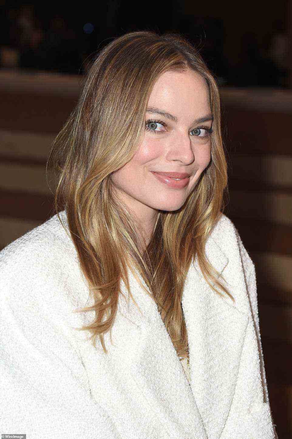 Stunning: Margot let her blonde tresses fall loose down her shoulders at the star-studded event