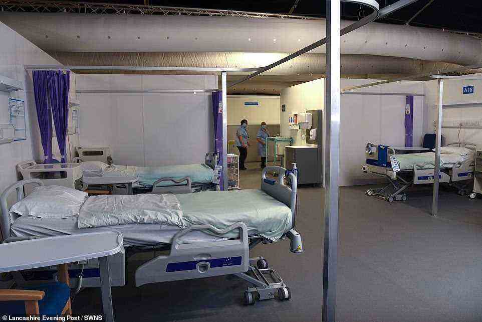 The Nightingale facilities - manned by a mix of hospital consultants, nurses, and other clinical and non-clinical staff - are designed to take patients who, although not fit for discharge, need minimal support and monitoring while they recover. Pictured: The Nightingale Surge Hub at Royal Preston Hospital
