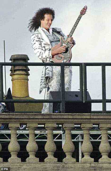 Queen's guitarist Brian May played the national anthem from the roof of Buckingham Palace to start the 'Party at the Palace' concert on 3 June, 2002