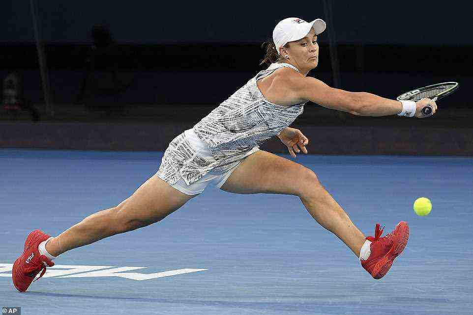 Pictured: Ash Barty desperately reaches out for a backhand slice during the women's Australian Open women's final