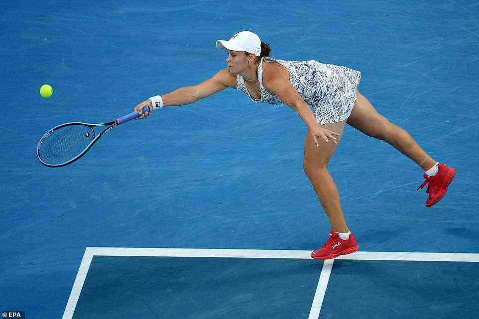 Ashleigh Barty stretches out to return serve against Collins in their women's Australian Open final