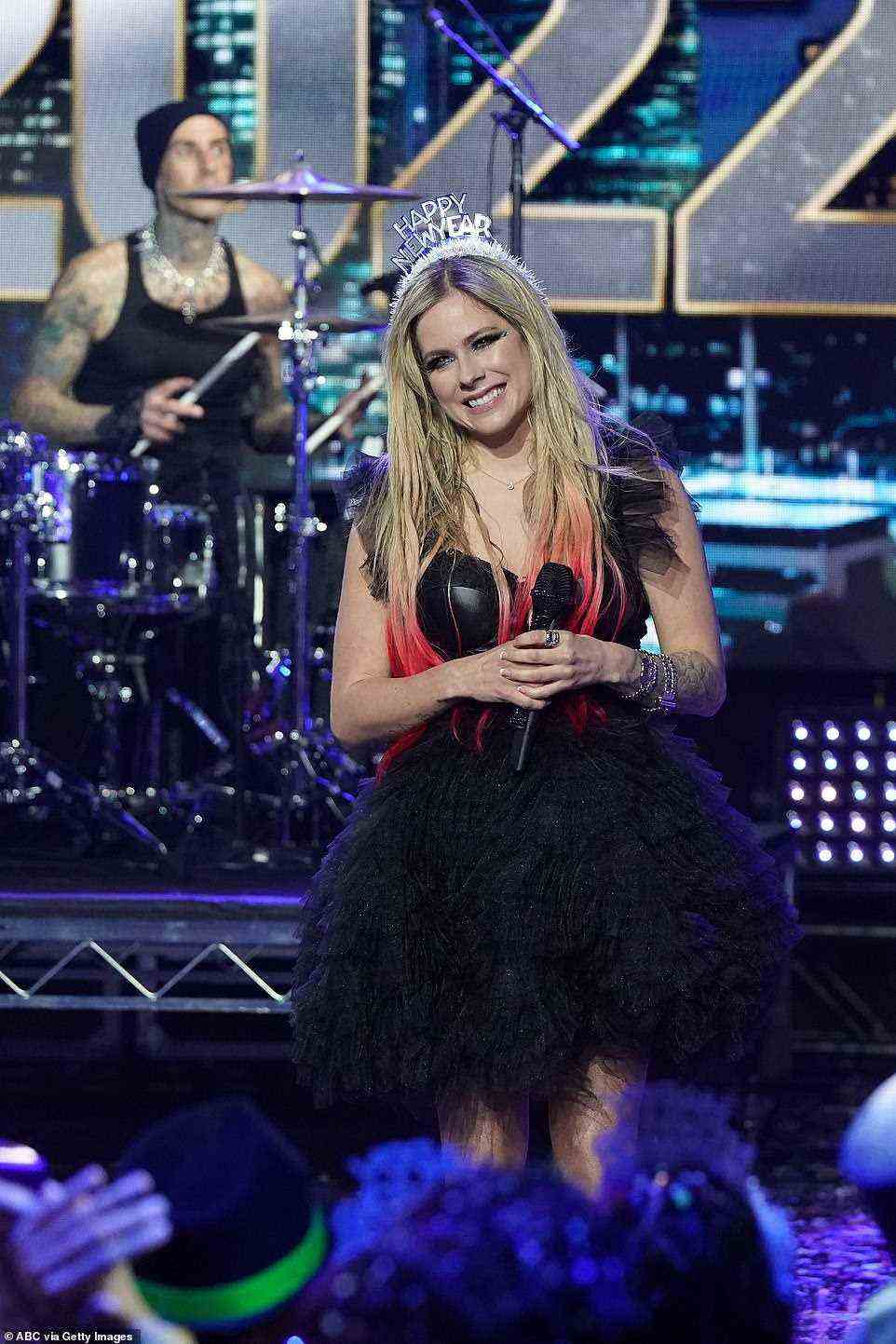 Rock on! Avril Lavigne joined up with Travis Barker to rock out to her hit Sk8er Boi from Los Angeles as they added some excitement to Dick Clark's New Year's Rockin' Eve on Friday Night