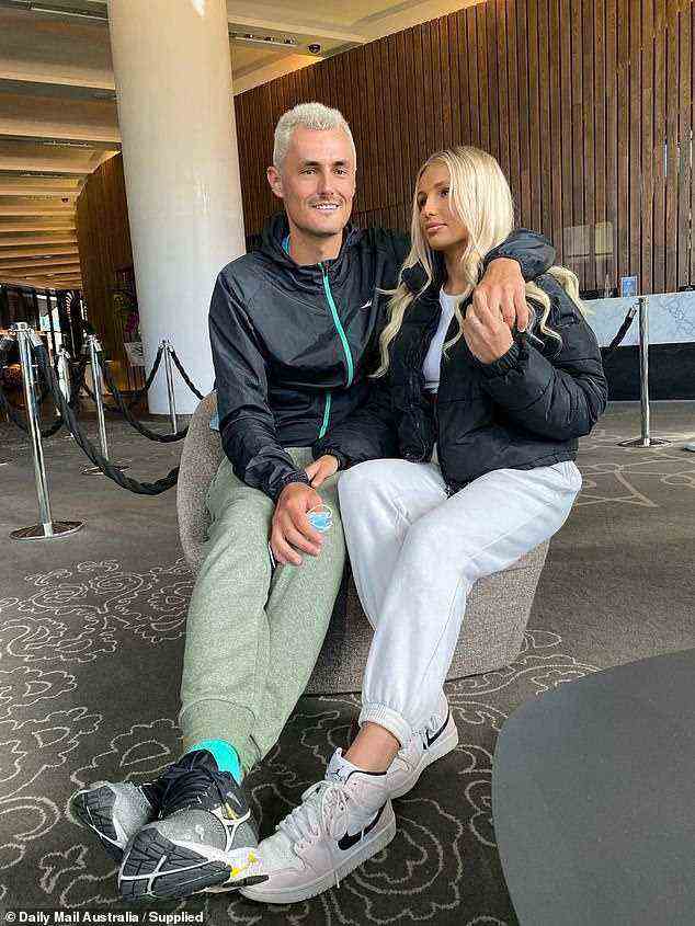 Forget the players, it's all about the WAGs! Meet the stunning women stealing the spotlight at the Australian Open. Pictured: Bernard Tomic, 29, and his influencer girlfriend Keely Hannah