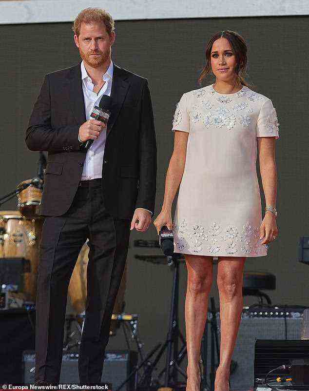 Prince Harry and Meghan Markle (pictured at Citizen Live in Central Park in September) have hit out at Spotify for hosting content with 'Covid misinformation'
