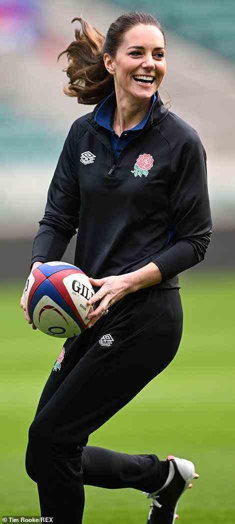 She's got the skills! Sporty Kate dashed across the pitch with a rugby ball during the training session at Twickenham