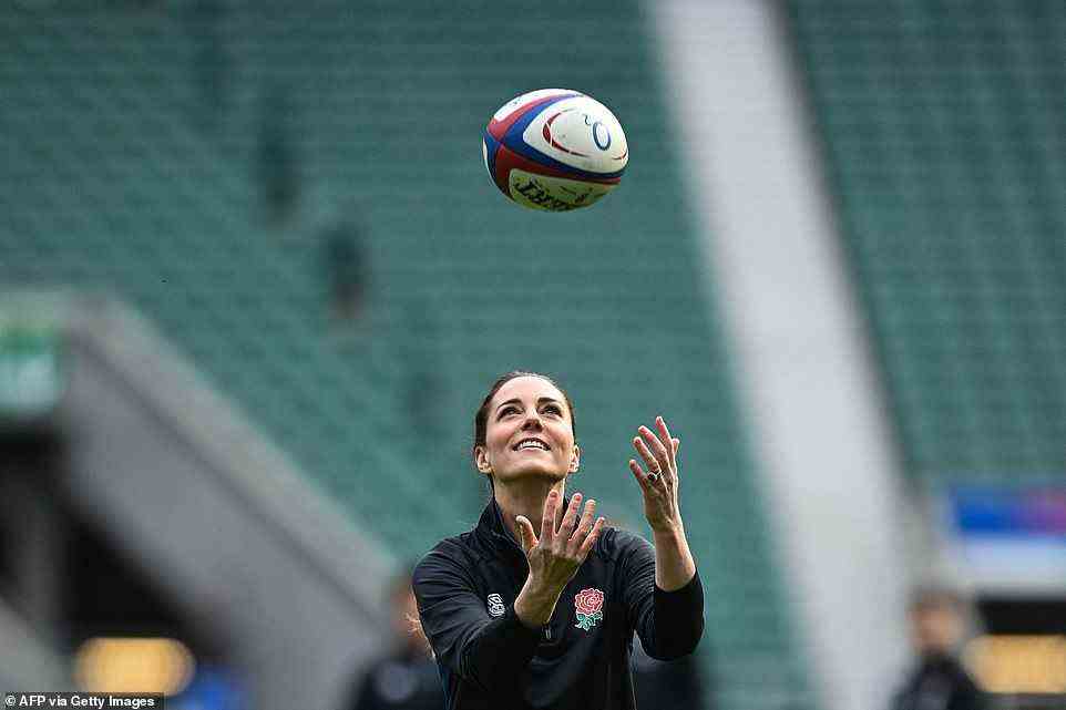 Throwabout: The Duchess of Cambridge enjoys watching rugby - but proved she can also play it at today's engagement