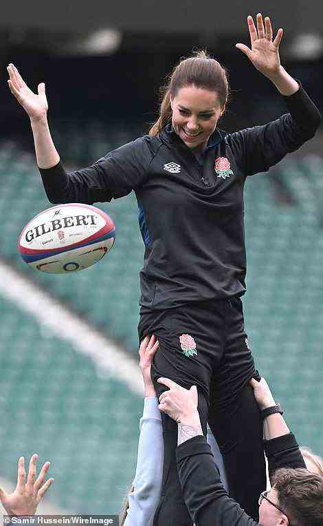 A high pass! Showing she's not afraid to get stuck in Kate threw the ball around while being lifted by strong members of the England squad