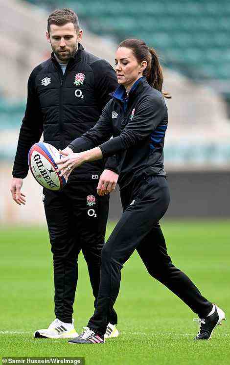 Duchess of Cambridge opted for adidas black boots with a pink stripe and an England Rugby jersey for her day on the pitch