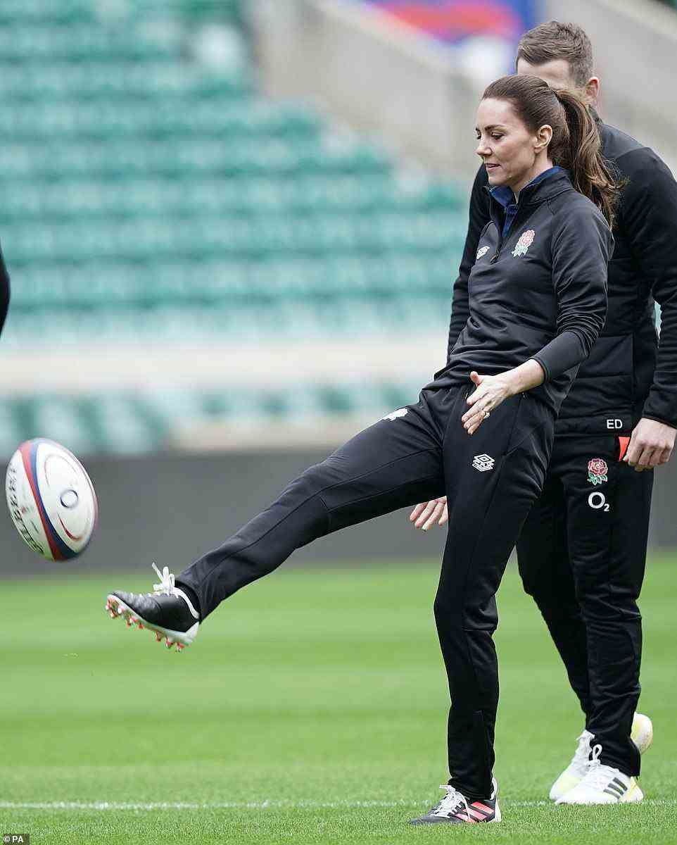 And we're off! Kate kicked the ball while looking ready to rumble with her hair tied back and opting for minimal make-up