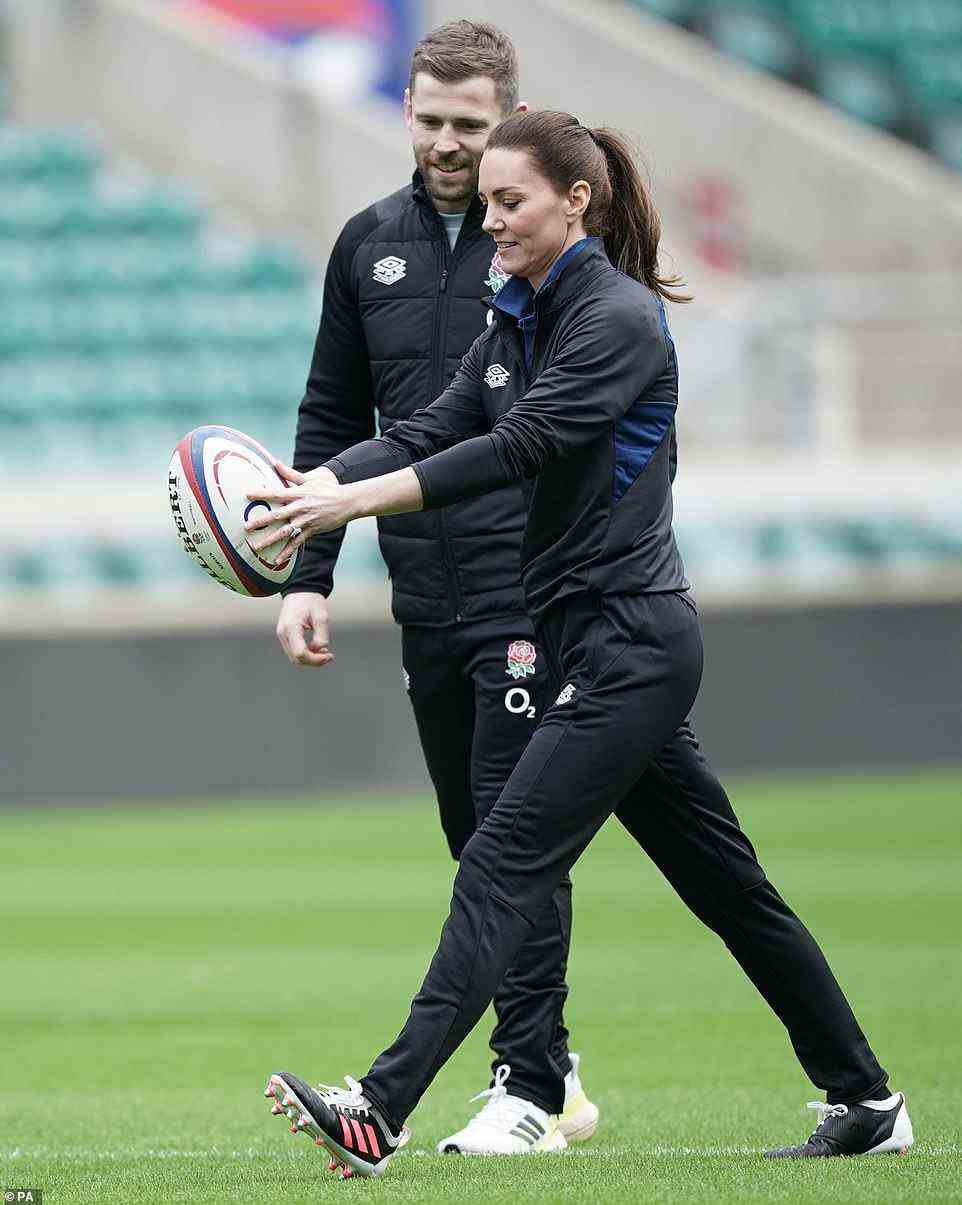 Waiting for the drop! Duchess of Cambridge, in her new role as Patron of the Rugby Football Union, is seen about to drop kick the ball during a visit to Twickenham Stadium