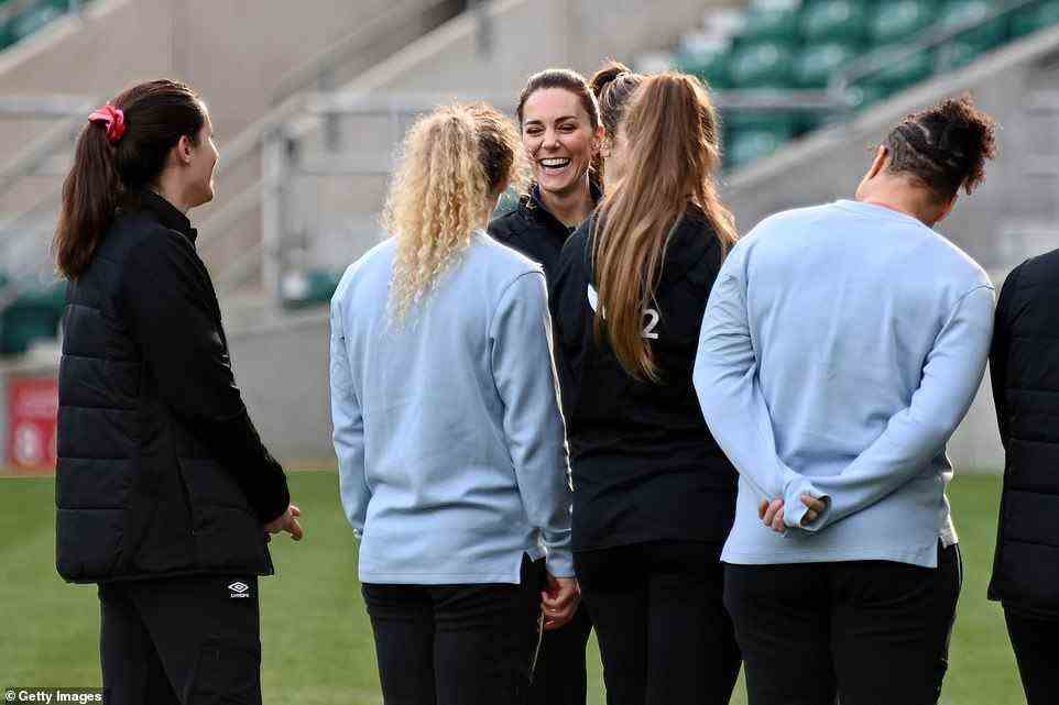 Light-hearted: The royal shared a joke with England rugby players ahead of the training session this morning