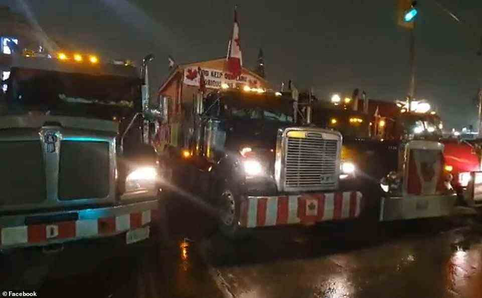 'Raining in Ottawa, but the truckers and protesters continue to stand firm', wrote one online