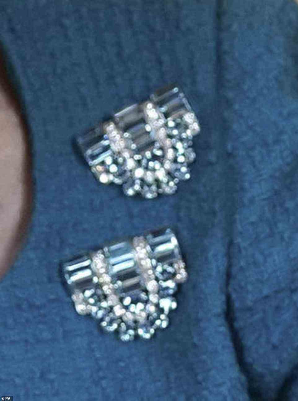 Her aquamarine and diamond clip brooches, worn separately in a diagonal setting on her turquoise dress, were an 18th birthday present from her beloved 'Papa', George VI, in April 1944