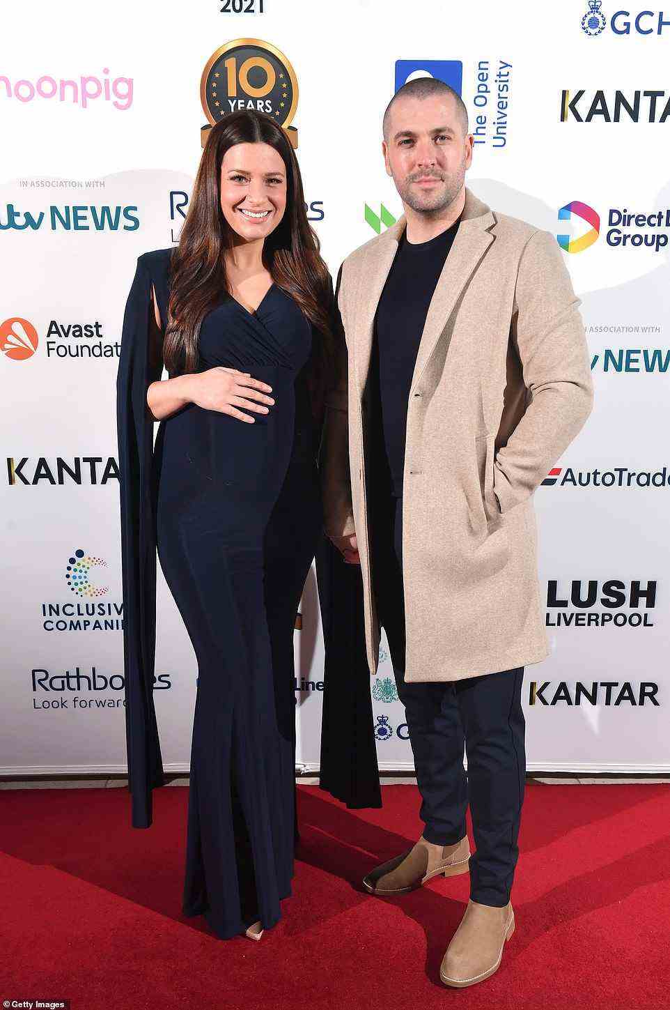 Loved-up: Shane Ward and his pregnant fiancée Sophie Austin looked very loved-up as they cosied up together on the red carpet