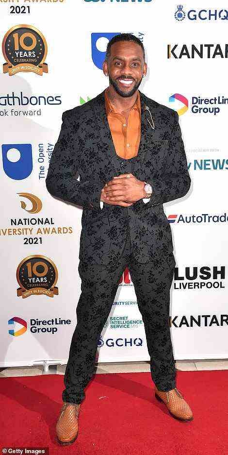 Dashing: Richard Blackwood looked sharp in a floral patterned black suit and eye-catching burnt orange silk shirt
