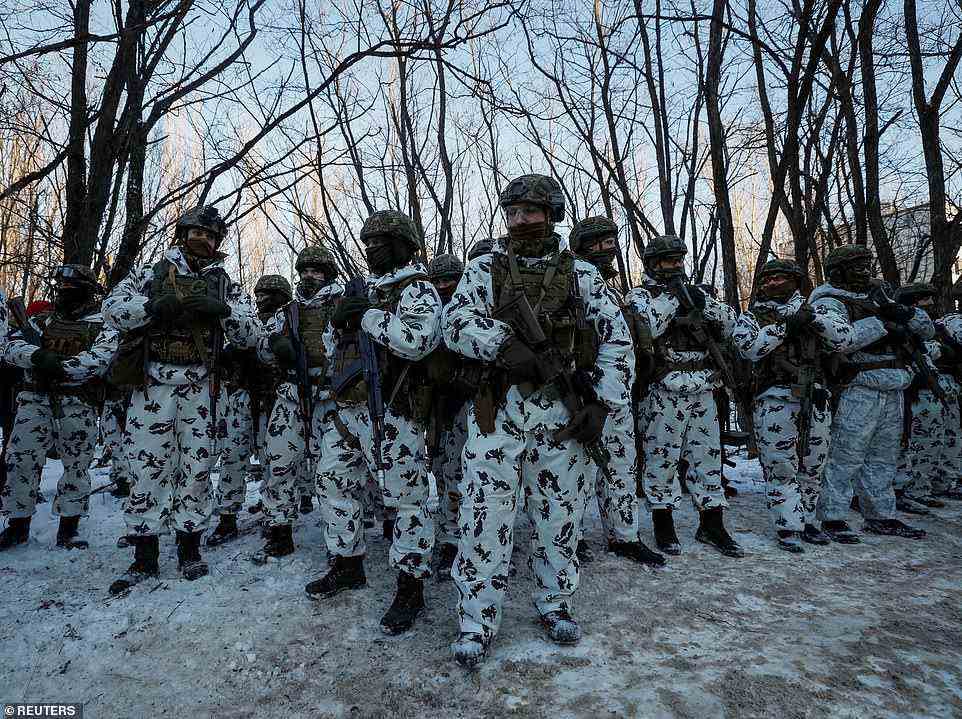 Ukraine is holding military exercises in Chernobyl, with troops firing at abandoned buildings and launching grenades in the deserted exclusion zone as Russian troops continue to amass on the border