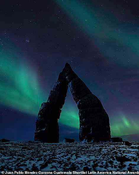 Thanks to this breathtaking image, Juan Pablo Mendez Garzona was shortlisted for the Latin America national award. The Guatemalan photographer reveals that the picture 'combines two photos' that were taken during a trip to Iceland. He says: 'The first one was taken at the Arctic Henge, a group of structures located in Raufarhofn on the northeastern tip of the Melrakkasletta peninsula. The second one is the sky full of Northern Lights, which I captured a few days later. For me, this composition represents an open door full of possibilities for those who dare to walk into the unknown'
