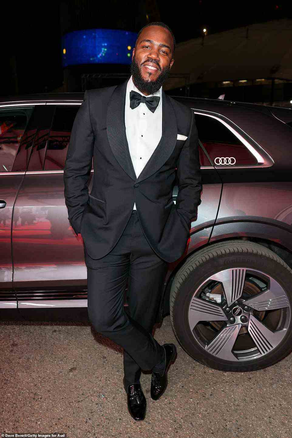 Looking handsome! Host Mo Gilligan looked suave in a black and white suit and wore a bow tie