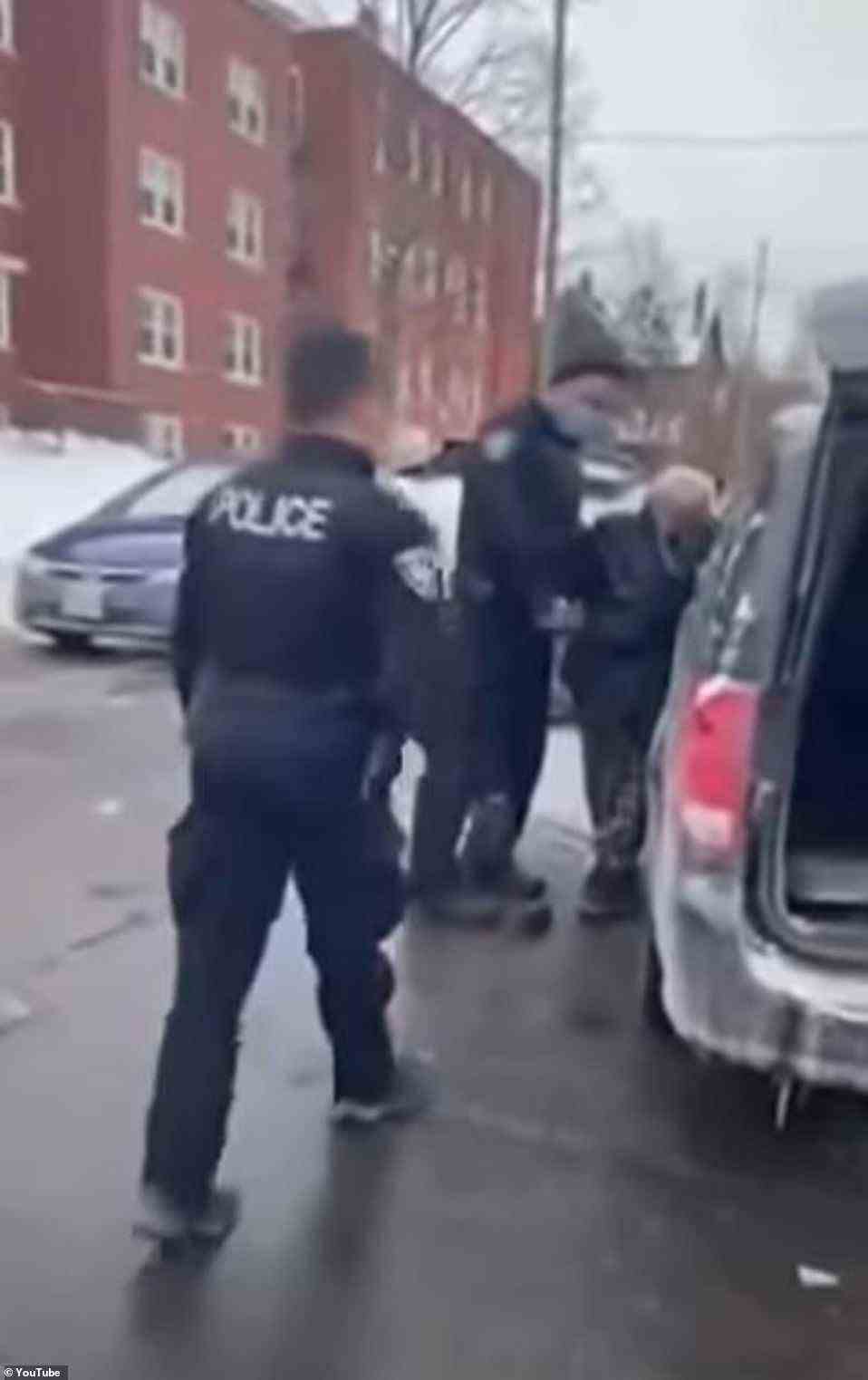 'This is b******. Communist f****** police,' a bystander yells as police arrest a man for honking in Ottawa on Sunday, a day before a judge outlawed honking, as protests against COVID-19 vaccine mandates continue