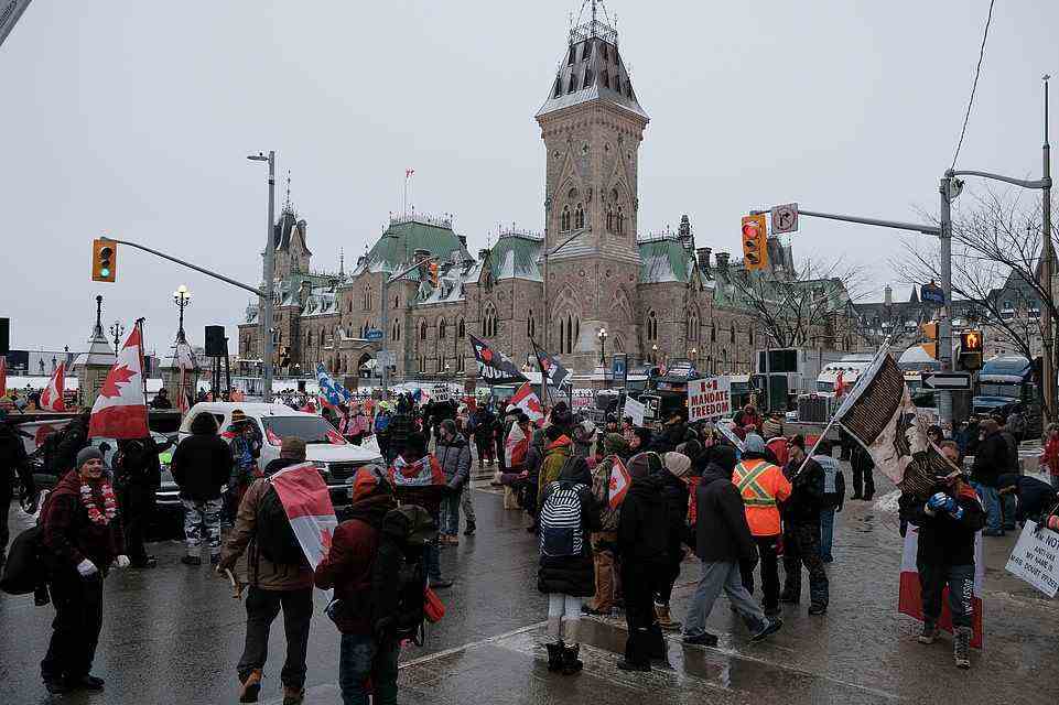 Crowds gather outside the Parliament building on Thursday, February 3. More protestors are expected to descend upon Ottawa this weekend, several area hotels and restaurants have closed for the next week in anticipation of further protests