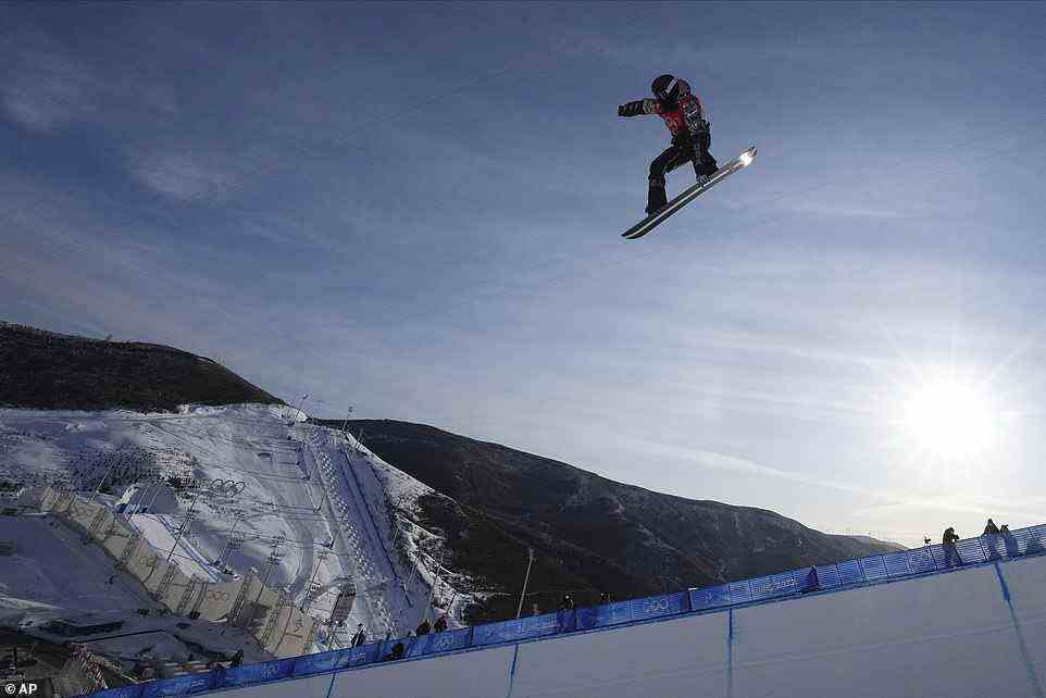 White finished fourth with a best score of 85.00 and the US snowboarder Taylor Gold, 28, of Steamboat, CO, was fifth with 81.75. He is seen here training before the finals on Friday