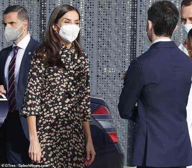 Putting safety first, Letizia wore a plain black face mask but donned her usual glamorous make-up underneath, opting for a warm peach coloured eye and subtle highlight