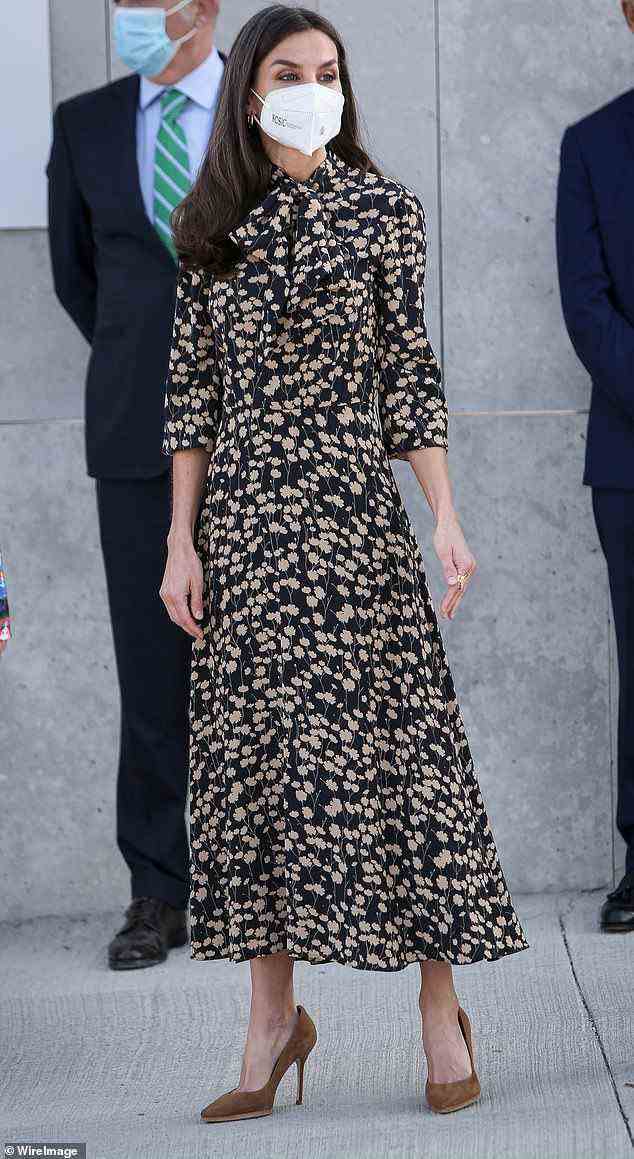 The Spanish monarch looked effortlessly chic in her stylish midi-dress at the event this morning