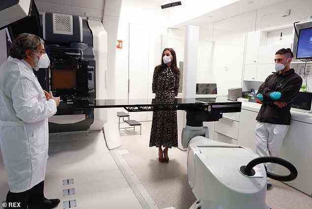 Letizia is pictured on a tour of the in Proton Therapy Centre at the Madrid University hospital in Pozuelo de Alarcon today