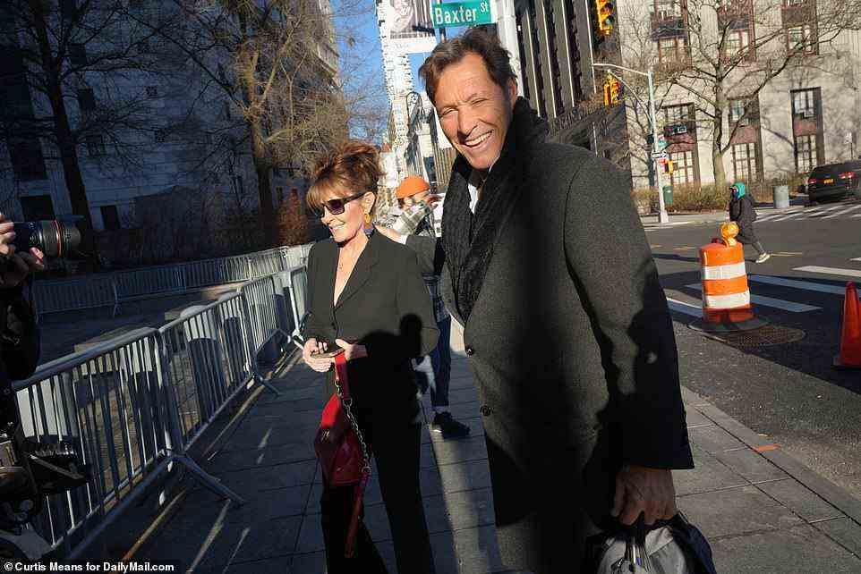 Sarah Palin and Ron Duguay hold hands as they arrive at Federal Court on the seventh day of her trial against the New York Times