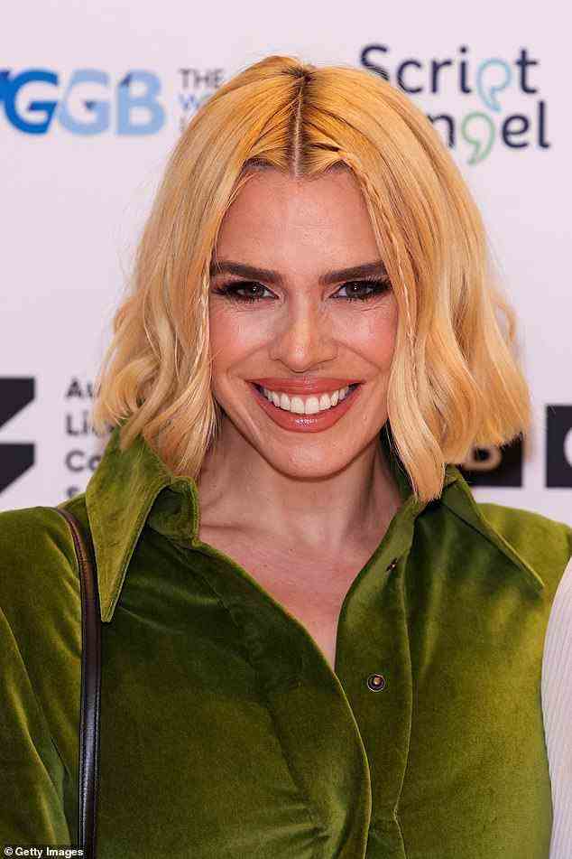 Star quality: Billie smiled as she posed on the red carpet while wearing lashings of make-up to highlight her pretty facial features