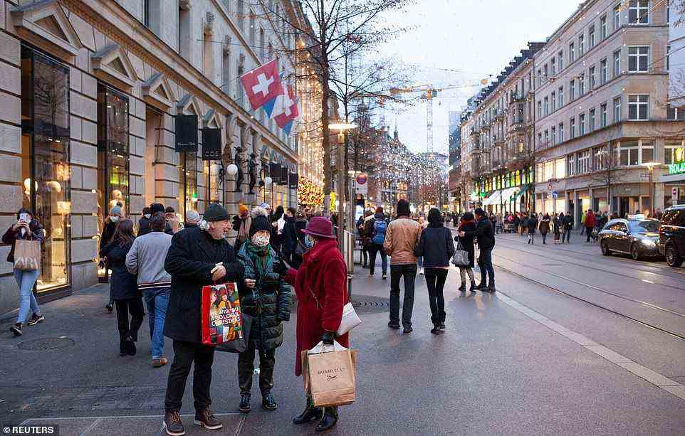 SWITZERLAND: Like Austria, from Thursday in Switzerland the only curbs in place will be the obligation to self-isolate for five days after a positive test. Pictured: shoppers in Zurich in December
