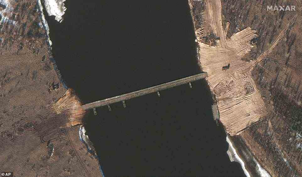 A satellite image reveals that a new pontoon bridge has been constructed across the Pripyat River in Belarus (left), around 80 miles north of Kiev amid fears it could be used to provide an attack route to the capital