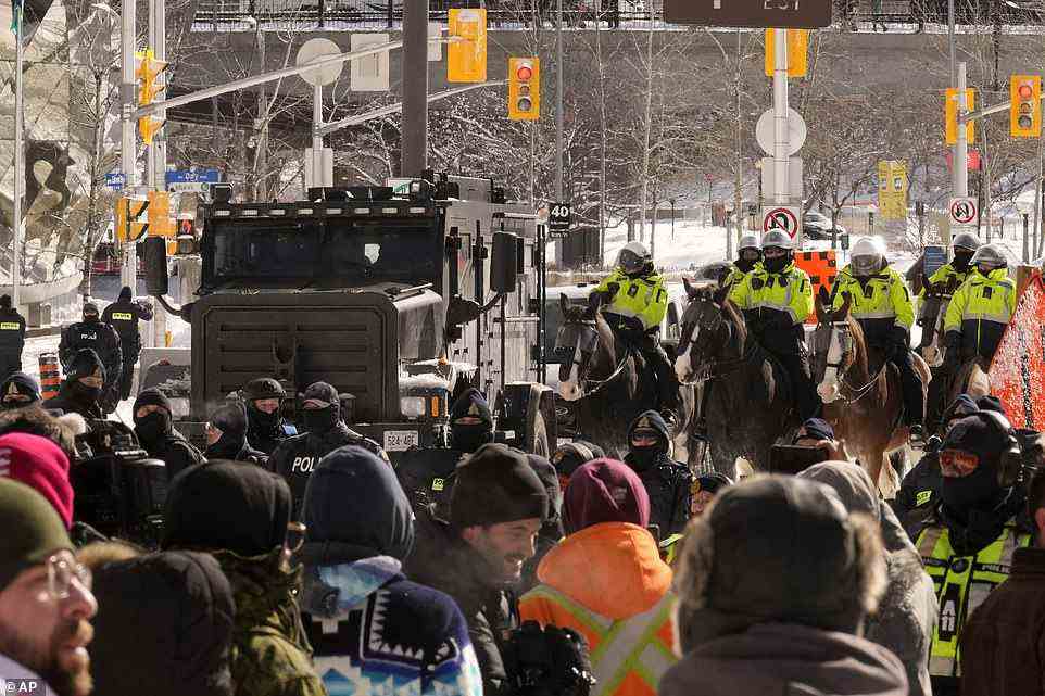 Police brought a dozen horses to confront protesters, backed by an armored vehicle