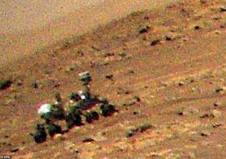 The high resolution camera allowed NASA to zoom in and show the SUV-sized Perseverance rover despite it being over 200ft away from the helicopter