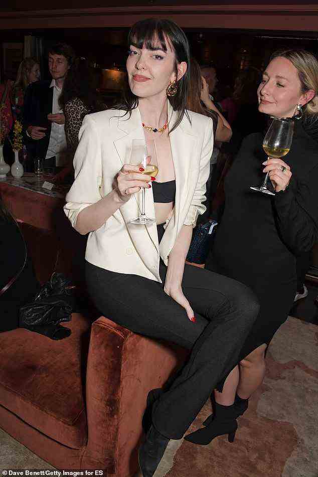 Lovely: Zoe Zimmer looked great as she sipped on a glass of white wine
