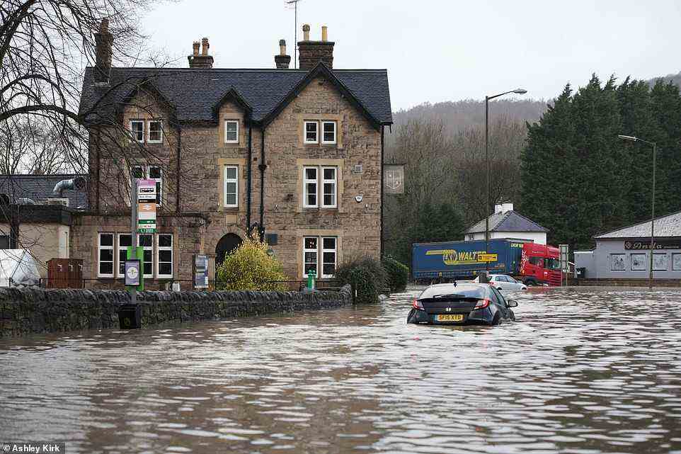 Cars stuck in floodwater as Belper in Derbyshire is swamped this morning amid the arrival of Storm Franklin overnight