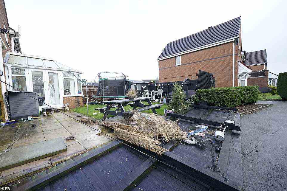 Damage to property in Barton upon Irwell, Greater Manchester, pictured today after Storm Franklin moved in overnight