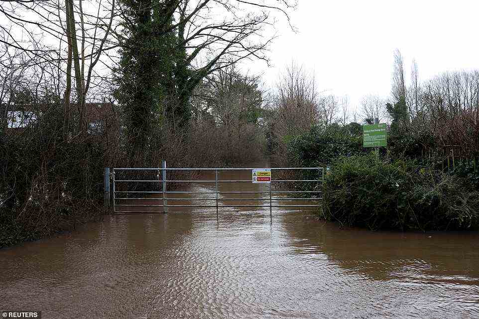 Didsbury Sports Ground is seen flooded today after the River Mersey burst its banks due to heavy rain in Manchester