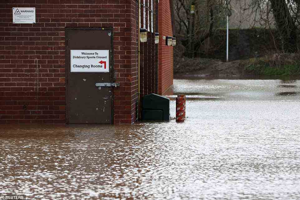 Didsbury Sports Ground is seen flooded today after the River Mersey burst its banks due to heavy rain in Greater Manchester