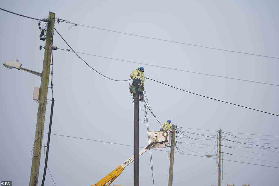ESB crews restore power to homes in Spanish Point, County Clare, on the west coast of Ireland today after Storm Franklin hit