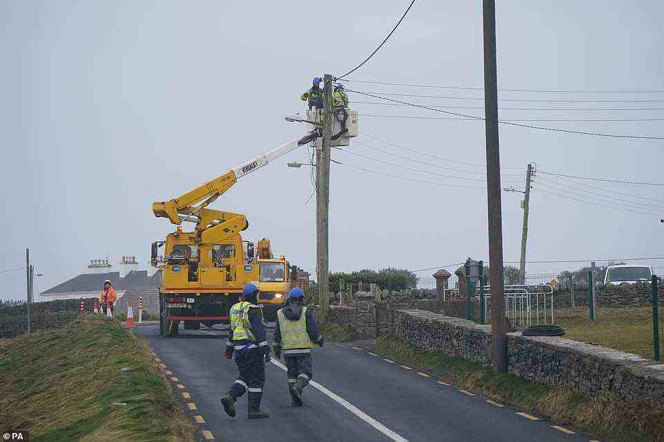 ESB crews restore power to homes in Spanish Point, County Clare, on the west coast of Ireland today after Storm Franklin hit