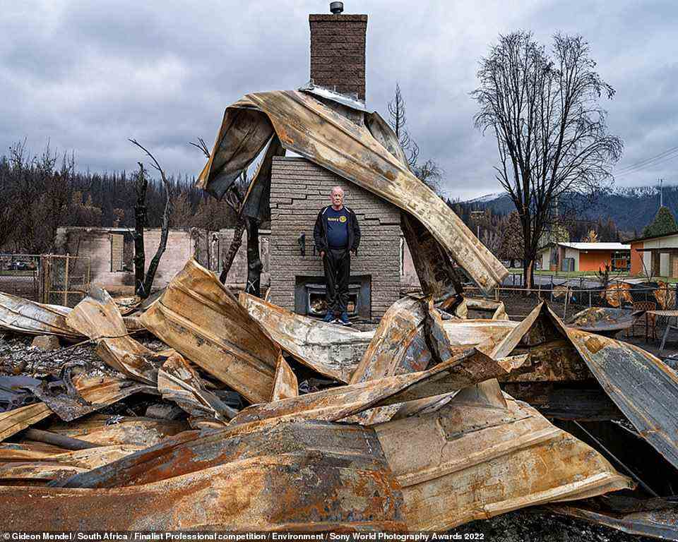 South African photographer Gideon Mendel 'portrays families and individuals within the empty shells of gutted buildings', the judges explained. Mendel was a finalist in the Environment category. In this shot, a man called John Banks stands in the ruins of his home in Greenville, California, which was destroyed by the Dixie Fire, an enormous wildfire that ravaged the state in 2021