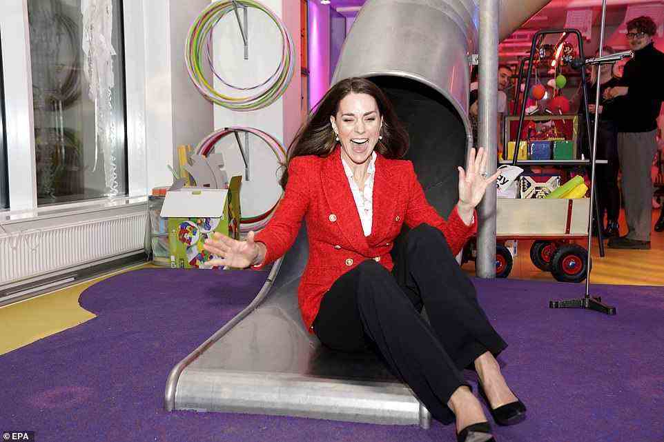 Weee! The Duchess looked delighted as she embraced her fun side and slid down the slide at the Lego play lab