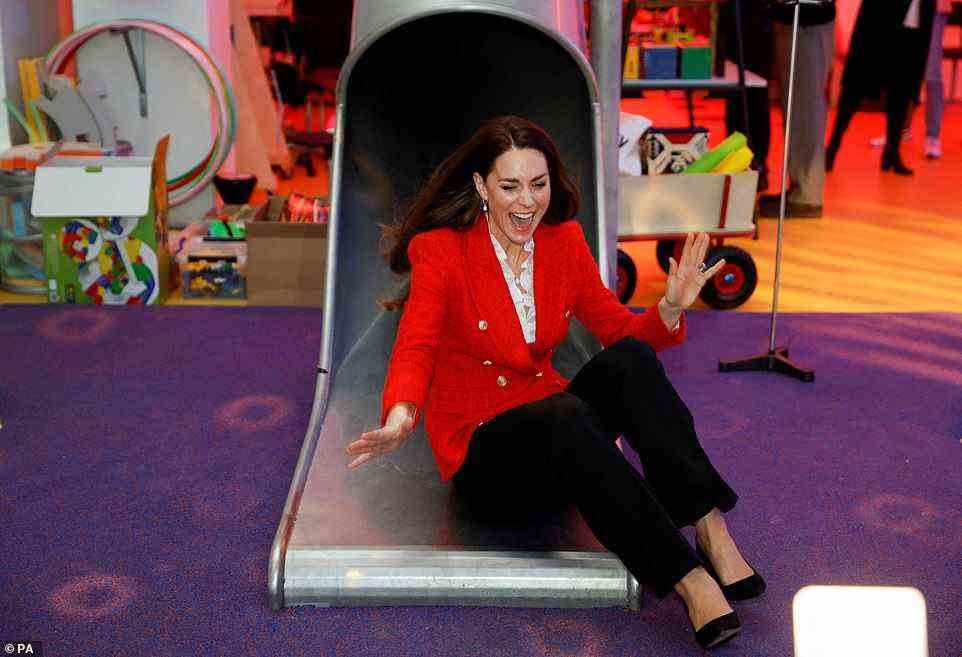 Kate laughs as she comes down a slide during a visit to the LEGO Foundation PlayLab at the Carlsberg Campus, University College Copenhagen