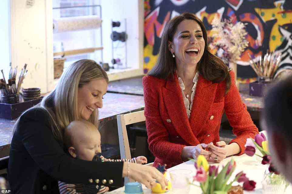 Hands-on as ever, Kate looked delighted as she smiled and got involved with the little ones paintings