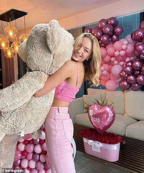 Konlin posed with a giant teddy bear, surrounded by pink balloons and roses in July 2021 - writing, 'Happy valentines Day .. still,' and some of her followers wondered if Hayut had sent them to her