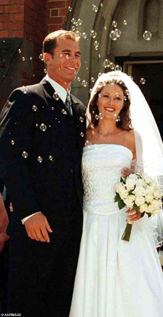 Former marriage: Carey is pictured with his first wife, Sally McMahon, on their wedding day in Wagga on January 20, 2001