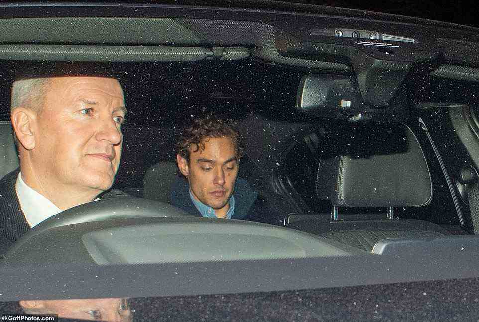 On their way to party! A guest keeps his eyes down as he arrives in the back of a car for the bash at Longleat House