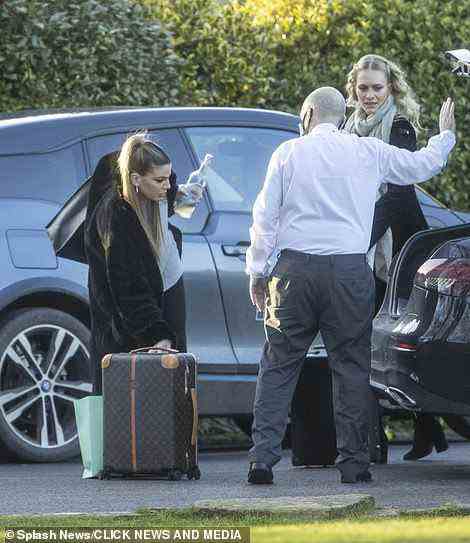 Bianca Brandolini looked effforlessly stylist with her monogrammed Louis Vuitton suitcase as she arrived with Poppy Delevingne