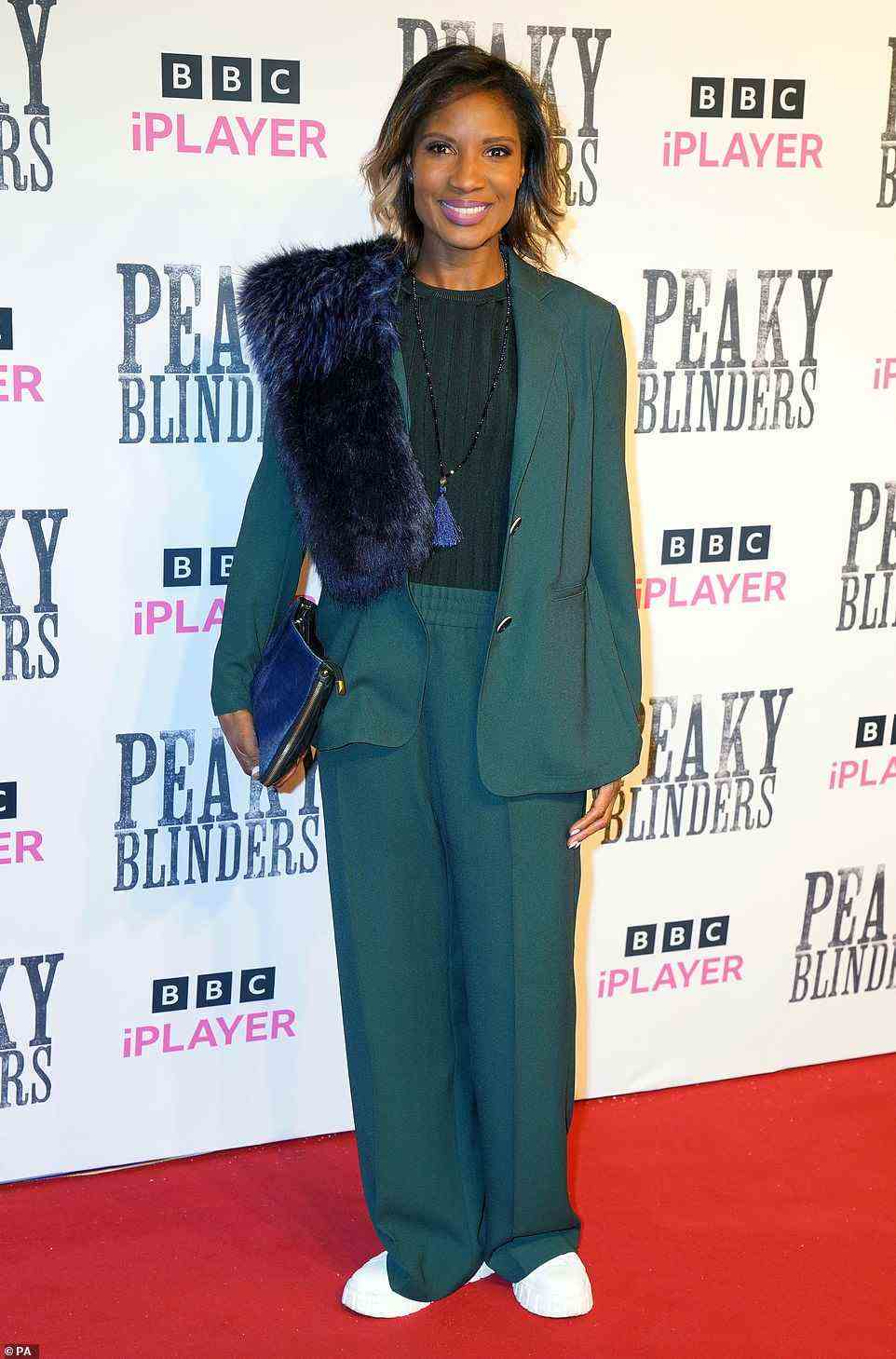So good: Sports star Denise added a casual element to her green suit with box fresh white trainers